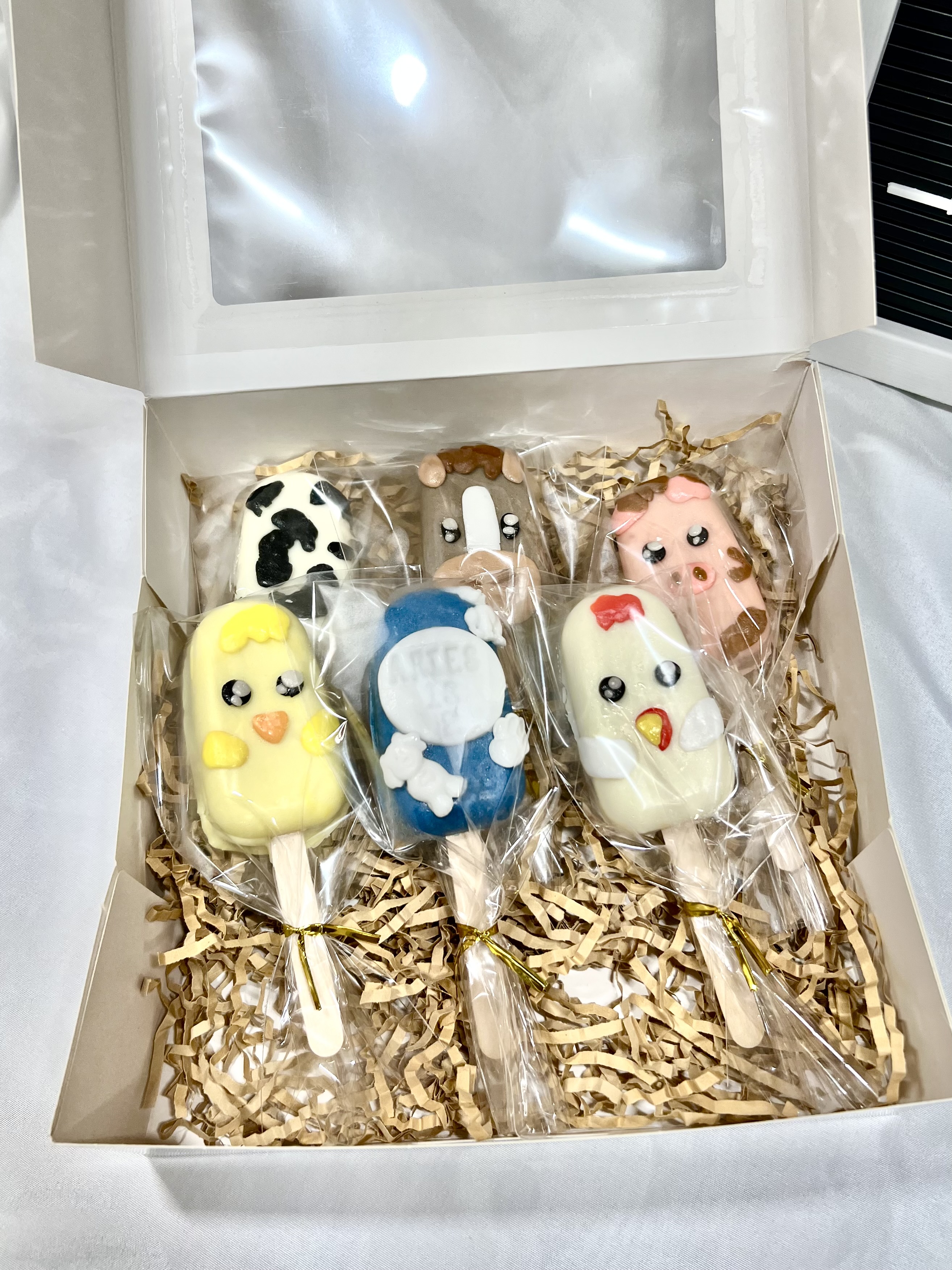 Farm animal cakesicles in a gift box