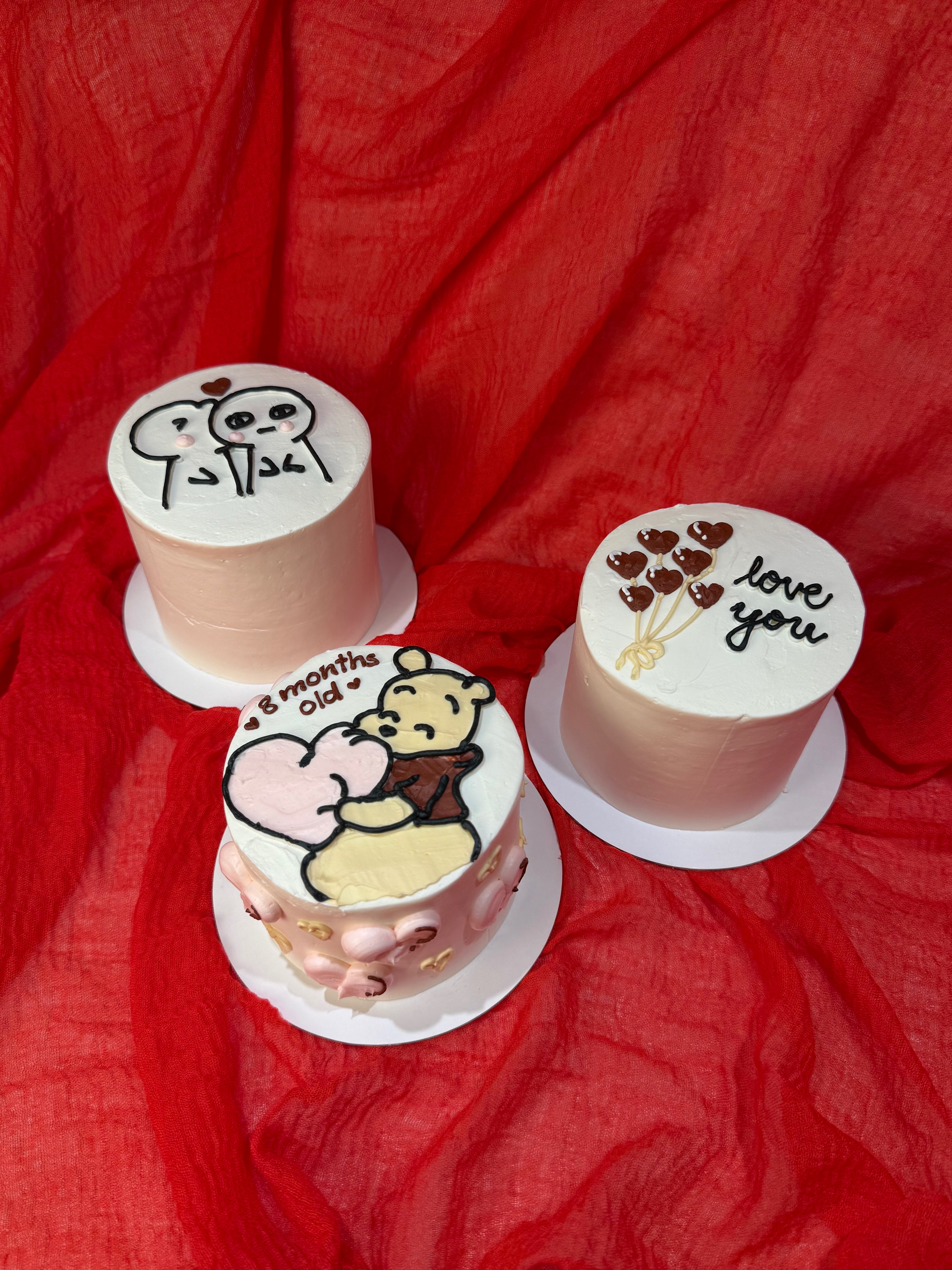 Three cute bento cakes with Winnie the Pooh and heart balloons