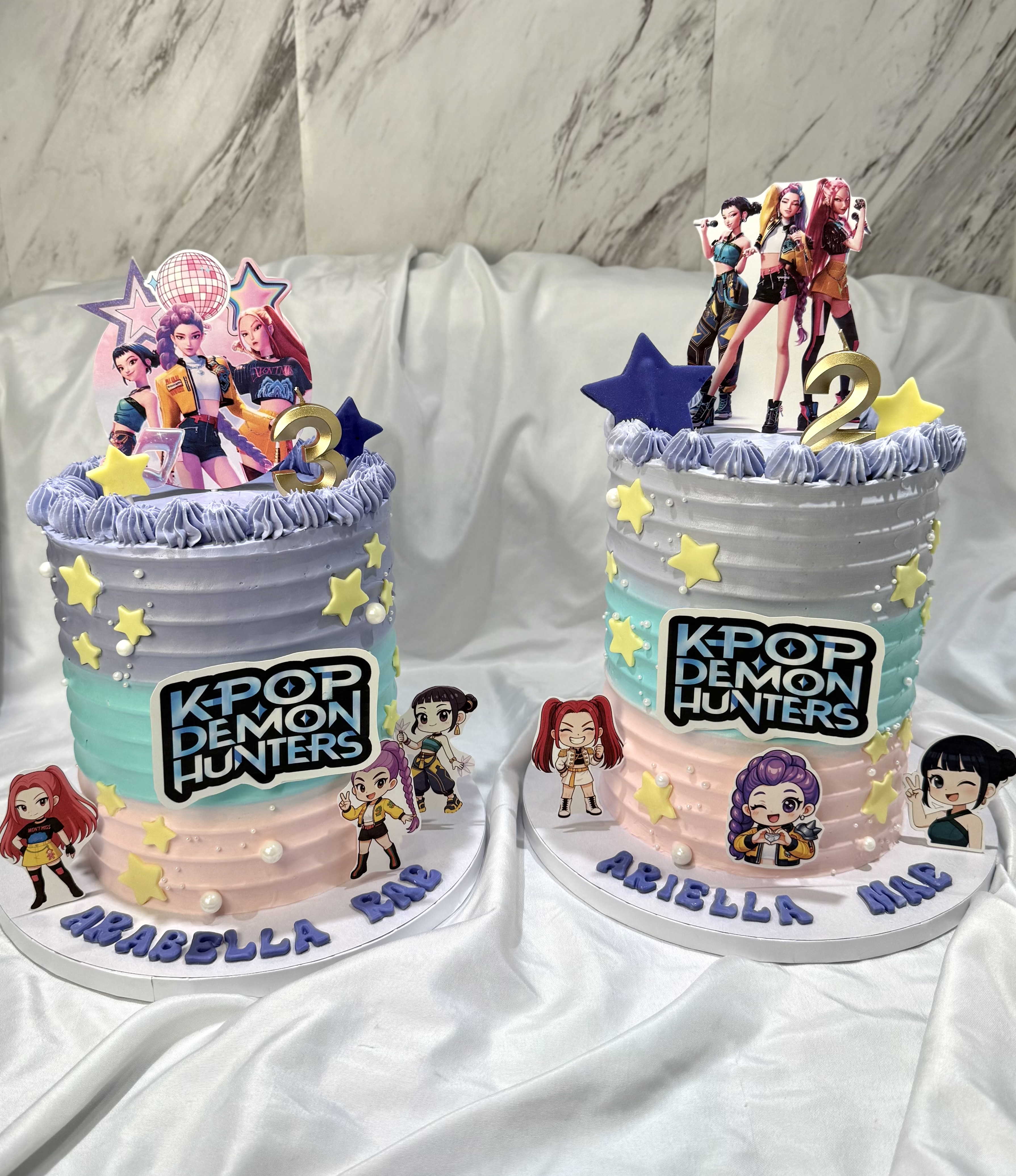 K-Pop Demon Hunters twin birthday cakes with pastel gradient