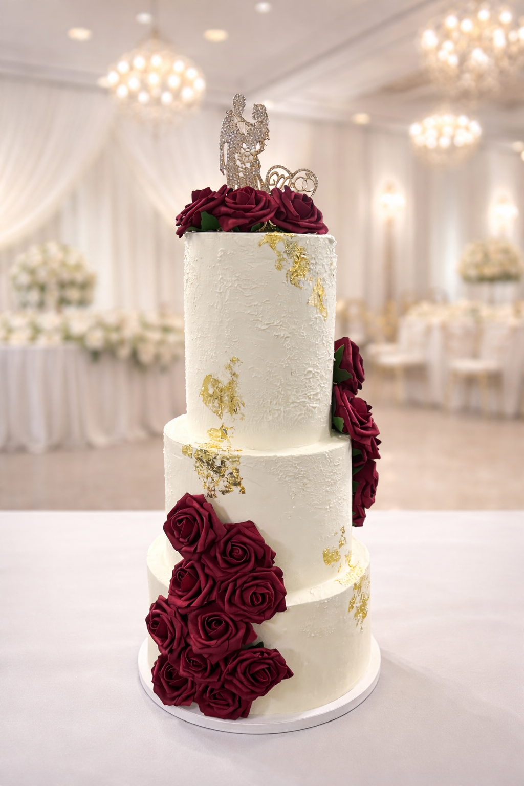 Pink two-tier fairy cake with satin ribbons and cherry-topped cream swirls