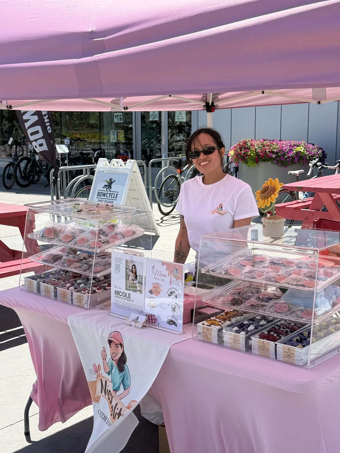 Nicole at her pink Nicsdelite pop-up market stall outside Bowcycle in East Village